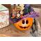 This image shows a fall table Halloween centerpiece. It is a witch made from a real gourd. Her name is Violet and has a purple witch hat.